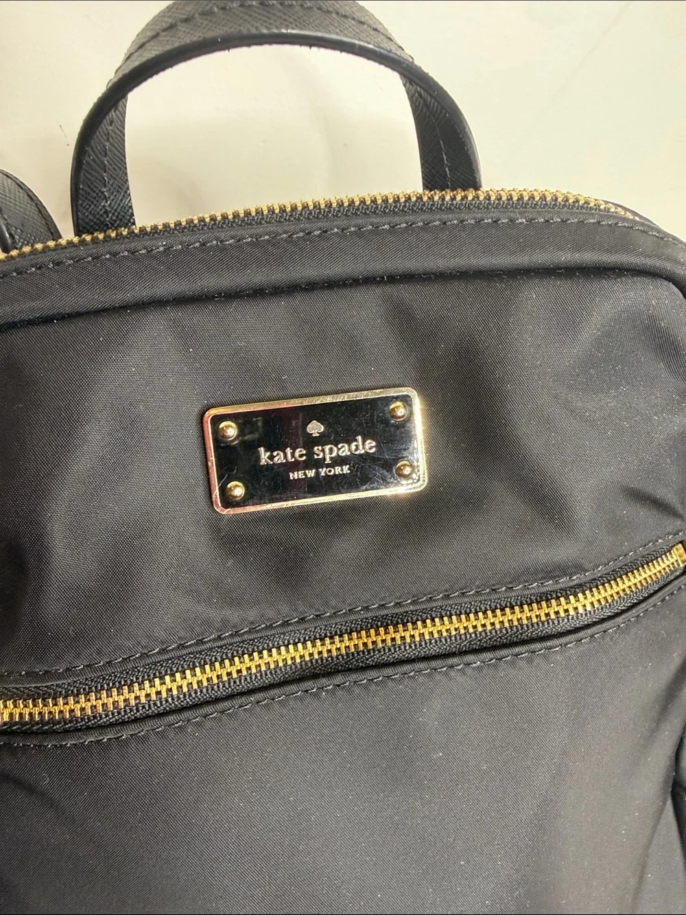 Kate Spade black nylon backpack with gold-tone hardware
